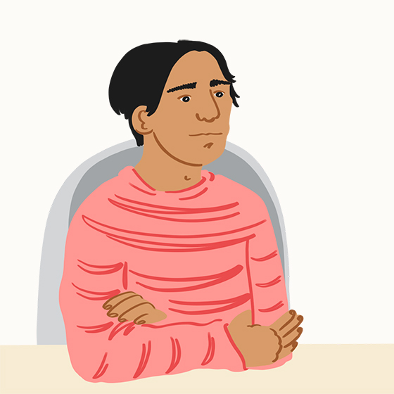 Person sitting with arms crossed