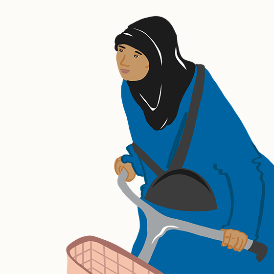 Person in a hijab riding a bike